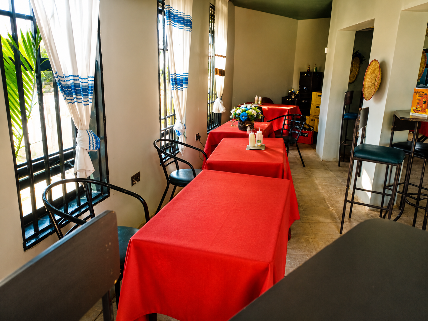 Trattoria dining area with red tablecloths